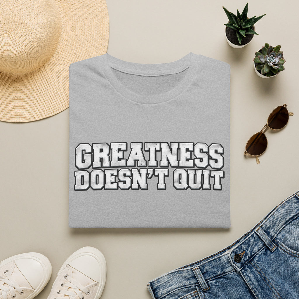 SatsandStripes.com Greatness Doesn’t Quit Softstyle® T-Shirt – Motivational Graphic Tee, Inspirational Shirt, Positive Mindset Gift for Men & Women Grey Folded