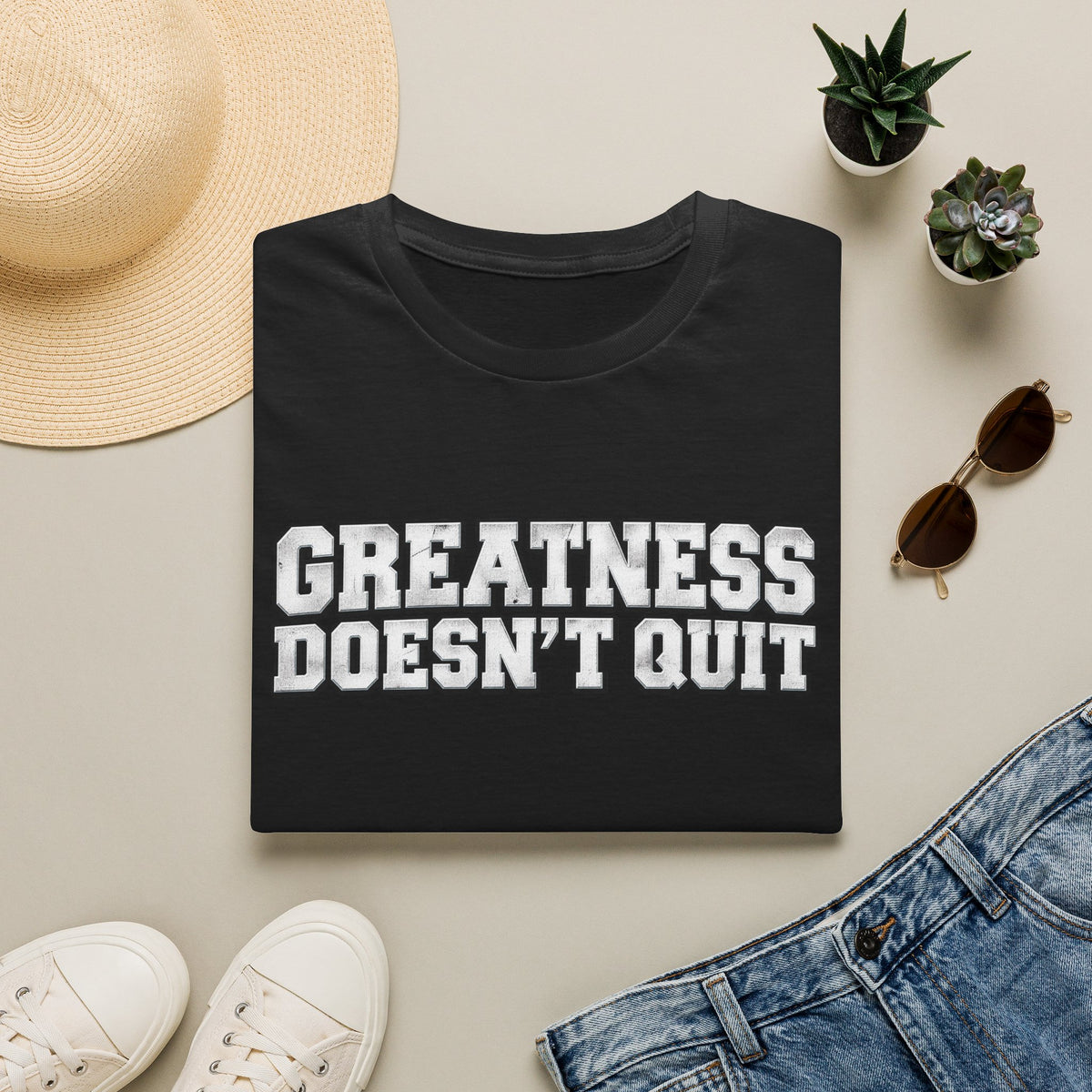 SatsandStripes.com Greatness Doesn’t Quit Softstyle® T-Shirt – Motivational Graphic Tee, Inspirational Shirt, Positive Mindset Gift for Men & Women Black Folded