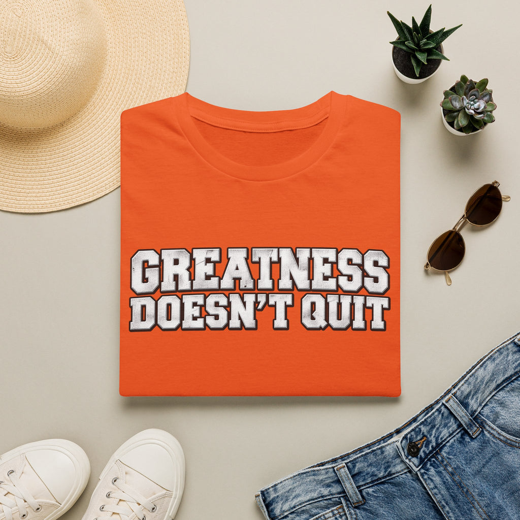 SatsandStripes.com Greatness Doesn’t Quit Softstyle® T-Shirt – Motivational Graphic Tee, Inspirational Shirt, Positive Mindset Gift for Men & Women Orange Folded